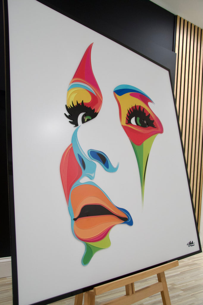 Abstract acrylic wall art of a woman's face in vibrant colors, designed to add elegance and bold style to modern interiors.
