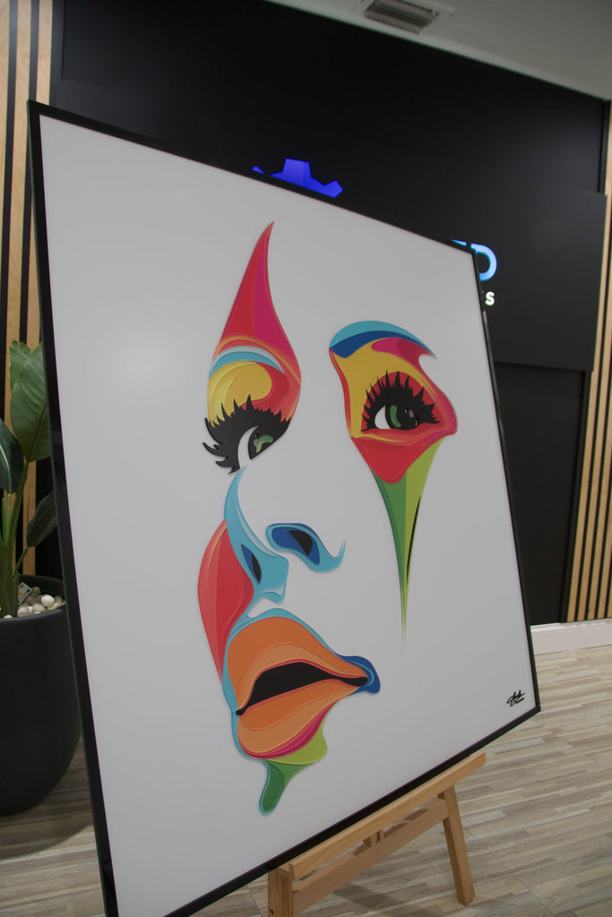 Abstract acrylic wall art of a woman's face in vibrant colors, designed to add elegance and bold style to modern interiors.