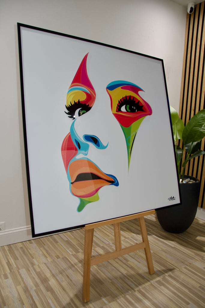 Abstract acrylic wall art of a woman's face in vibrant colors, designed to add elegance and bold style to modern interiors.